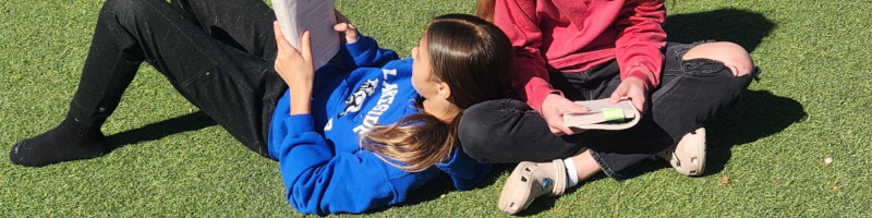 students at Lakeside Christian School in Clearwater, Fl read together outside