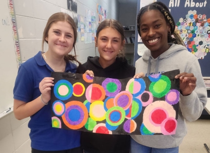middle school art students at Lakeside Christian School display their artwork